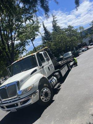 Flat bed tow truck and Range Rover Sport