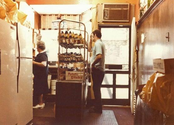 This photo was taken from the back table of the Original Moe's Sandwich Shop c1967. That is Rosa Pagano making the sandwich.