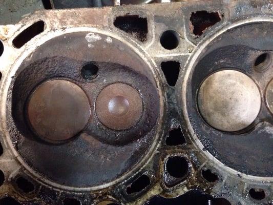 Long term water damage from a blown head gasket and if you look closely you can see a crack between the valves