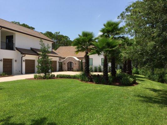 New construction. Brick paver driveway, full landscaping installation. Palm trees, shrubs, Irrigation, sod & pine straw installation.