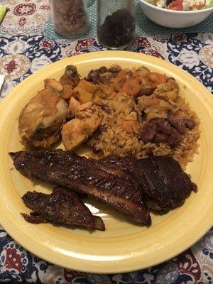 Roasted chicken Spanish rice and beans.  Pork ribs