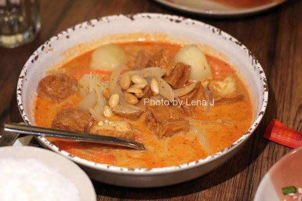 Fried Tofu Massaman Curry ($16.95) - potato, onion, carrot and roasted peanuts served with jasmine rice