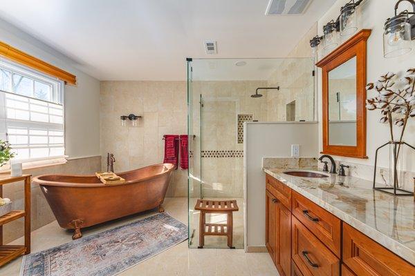 Master Bathroom Remodel in Dulles, VA with free-standing copper bathtub & brass fixtures