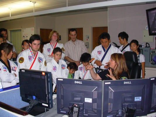 students taking tour of Orange police Dept.