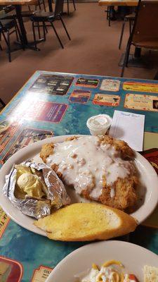 8.95 chicken fried steak and bake potato and a salad.