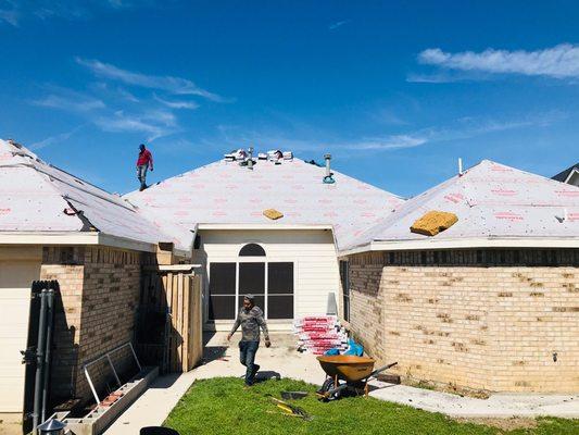 Removing of old shingles and felt- replacing with new synthetic felt and 30 year lifetime shingles