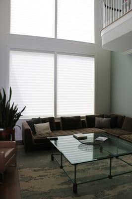 One of our installations featuring four large motorized Hunter Douglas Silhouette shades that operate on a single button.