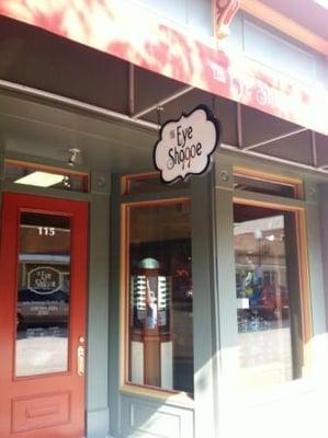 Awning, door graphics and wood sign for the eye shoppe in St. Charles