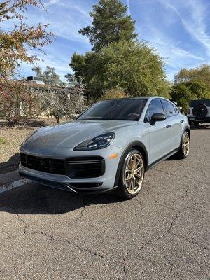 In this image is a Porsche fully detailed scrubbed and waxed with tire shine application