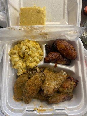 Island wing server plate with macaroni & cheese and plantains. Cornbread comes with every meal