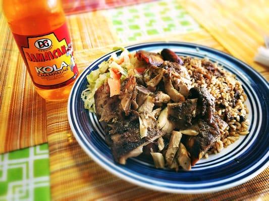 Jerk chicken and Jamaican Kola with rice and beans