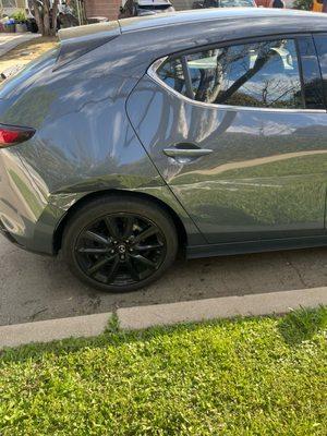 Fender scrape that stretched and dented all the way to rear passenger door.