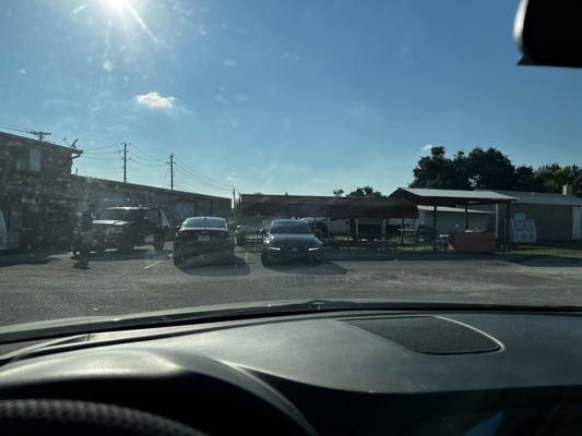 The not crowded parking lot with sooooo many customers waiting 20-30 minutes for their sno cones.