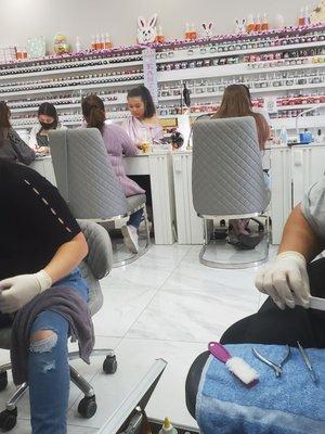 Nail techs working