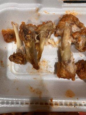 Easily broken bones clearly from a 2nd cook on the wings & the tips of the flats blown off after popping in your mouth.