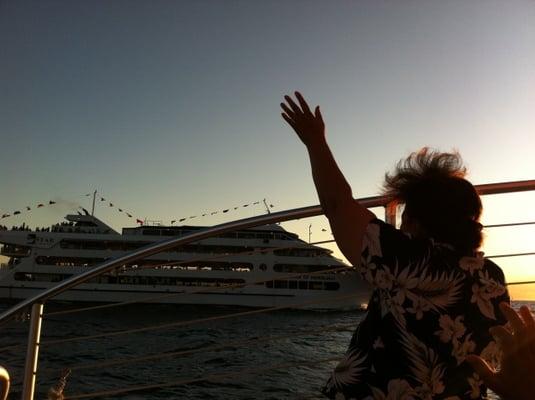 My mom waving to the people on the Star of Honolulu