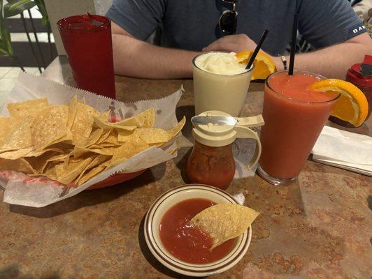 Virgin strawberry daiquiri, virgin pina colada, chips and Complementary Salsa