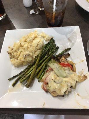 Smothered grilled chicken with garlic mashed potatoes and asparagus