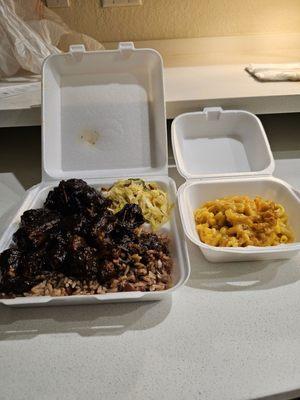 Oxtails, rice & peas, cabbage, mac & cheese