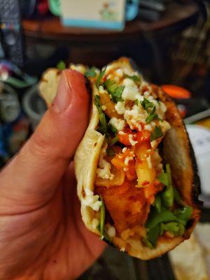 Chicken bulgogi taco to go with flour tortilla, kimchi, and Dragon Sauce