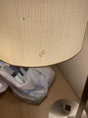 Unknown stain on lampshade.