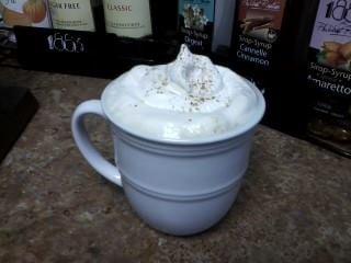 Latte with whipped cream and nutmeg