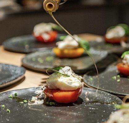 Truffle burrata heirloom tomato basil starter