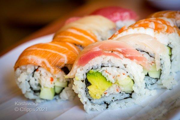 Specialty Roll  RAINBOW Tuna, salmon, hamachi and shrimp sashimi over california roll