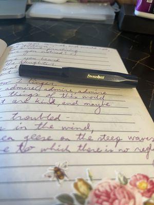 Kaweco Sport fountain pen in dark blue, and journal with Kaweco Summer Purple ink for a poem by Mary Oliver