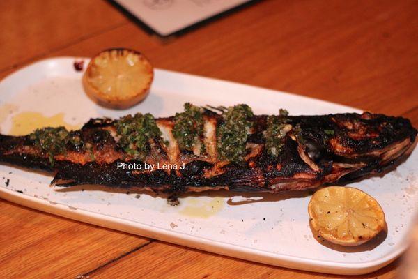 Fire Roasted Branzino ($37) - whole fish, gremolata, charred lemon