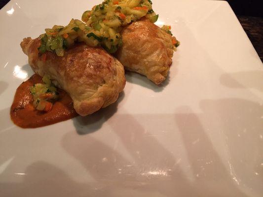 Puff pastry stuffed with chicken and cheese served with mango salad