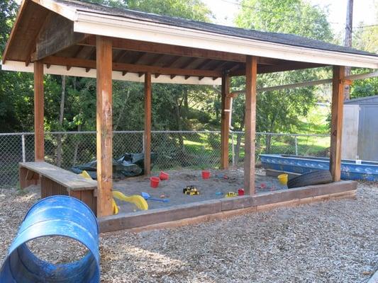 The kids love the covered sandbox!