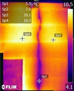 Infrared scan of cracked chimney showing cold air leakage