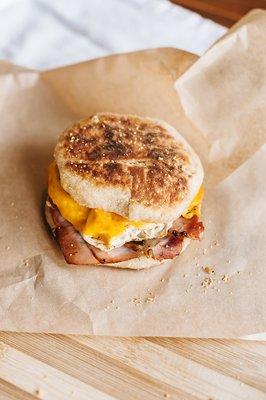 From scratch English muffins, baked in house, with house smoked Canadian bacon, egg, and cheese.