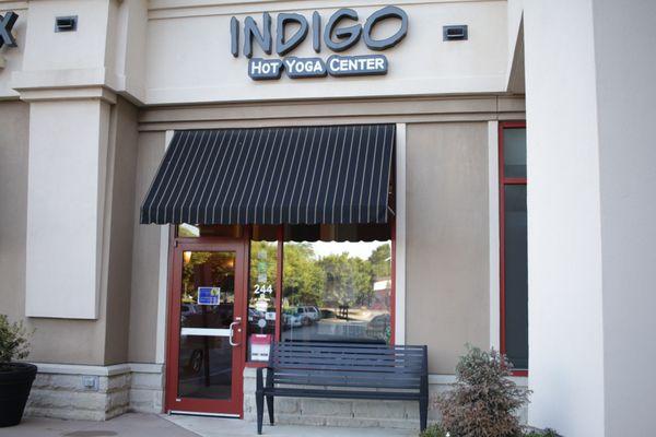 Indigo Hot Yoga Center Raleigh entrance. Yogis like to cool down and chat after class on our bench!