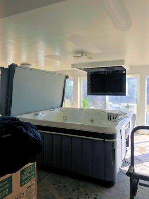 Spa-Room with a drop TV and rain shower for filling tub.