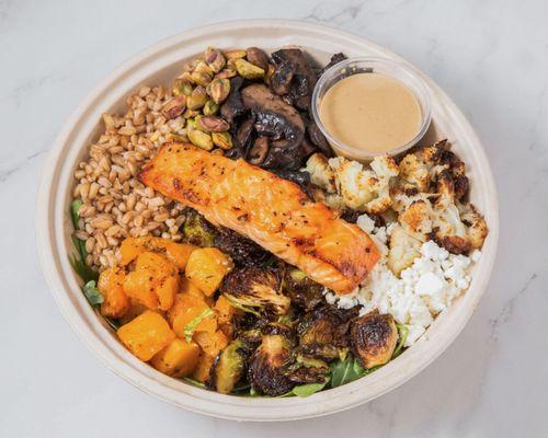 Create your own with fresh roasted salmon, portobello mushrooms, Brussels sprouts, roasted cauliflower, farro, pistachios and feta cheese