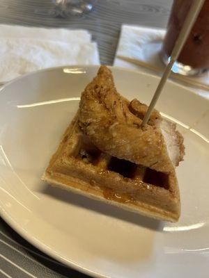 Chicken & Waffles drizzled with maple syrup