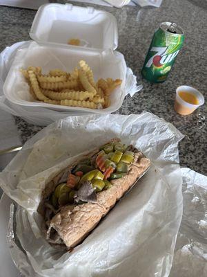 Italian beef- wet with Hot and sweet peppers Cheese fries and a drink.