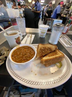 Bacon grilled cheese (added tomatoes) with small bowl of chili. Coffee and water :)