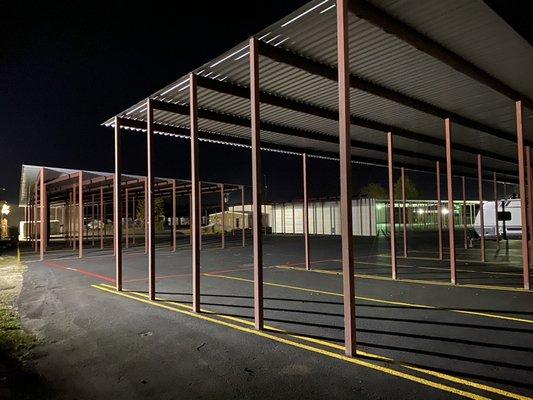 Covered Boat and RV parking area at night.