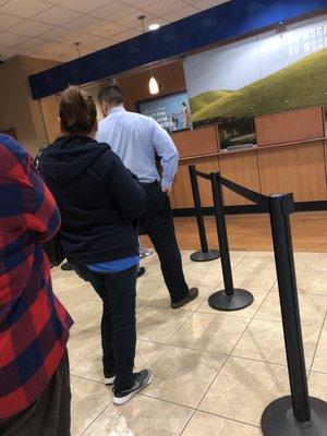 Worst service ever, 9 people in line, and only one teller.