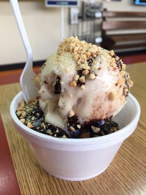 Almond amaretto ice cream sundae with chocolate fudge and nuts