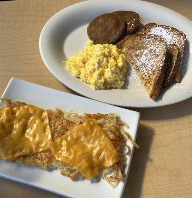 French toast with scrambled eggs & sausage and a side of hash browns with cheese