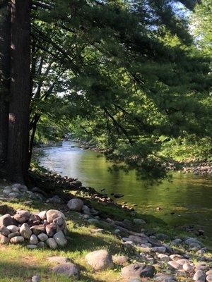 River behind cabin coming from downtown