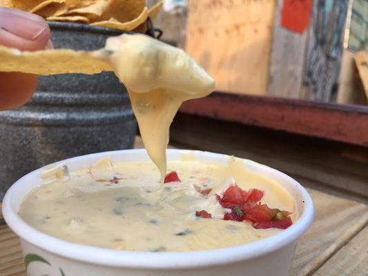 Chips and creamy, peppery gooey queso