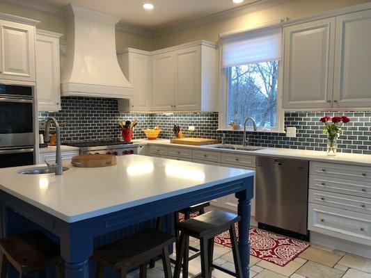 Frosty Carina White/Grey Quartz Countertops and blue subway tile backsplash