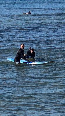 Virginia and Turtle learning the ways of surfing.