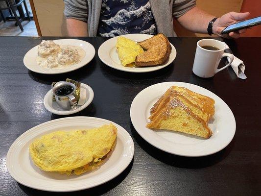 From top left:  biscuits and gravy, Chef's omelette with wheat toast, French toast with tad of confection sugar, another Chef's omelette...