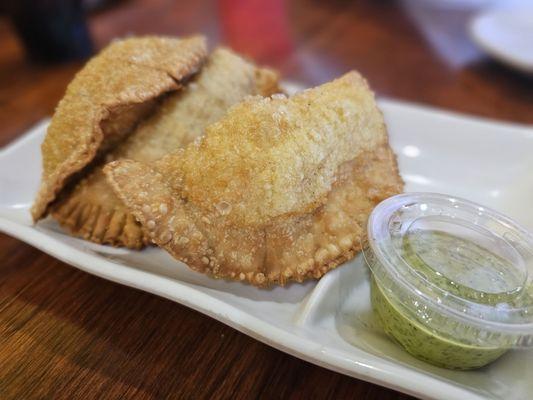 Chicken empanadas with green sauce